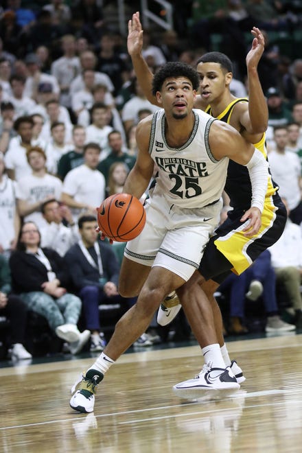 Michigan State forward Malik Hall drives against Iowa forward Kris Murray during the first half of MSU's 63-61 win on Thursday, Jan. 26, 2023, at Breslin Center.