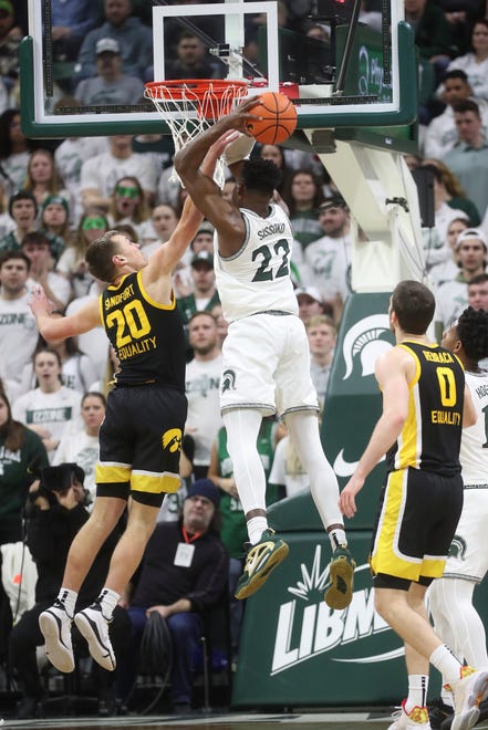 Michigan State center Mady Sissoko rebounds against Iowa forward Payton Sandfort during the first half of MSU's 63-61 win on Thursday, Jan. 26, 2023, at Breslin Center.