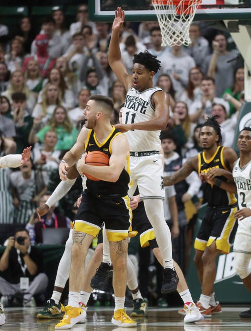 Michigan State guard A.J. Hoggard defends against Iowa guard Connor McCaffery during the second half of MSU's 63-61 win on Thursday, Jan. 26, 2023, at Breslin Center.