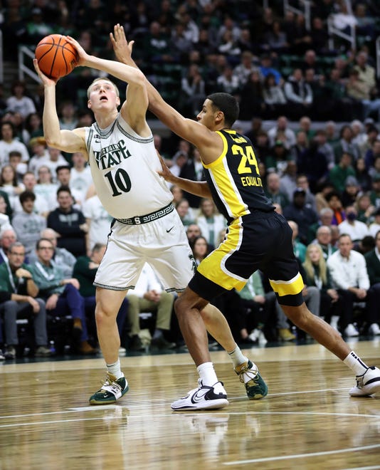 Michigan State Spartans forward Joey Hauser (10) shoots against Iowa Hawkeyes forward Kris Murray (24) during first half action Thursday, January 26, 2023.