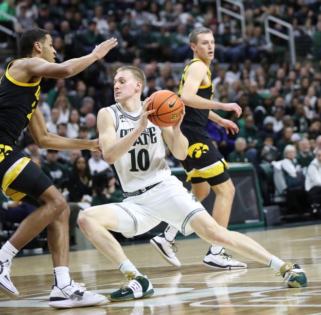 Michigan State forward Joey Hauser drives against Iowa forward Kris Murray during the first half of MSU's 63-61 win on Thursday, Jan. 26, 2023, at Breslin Center.