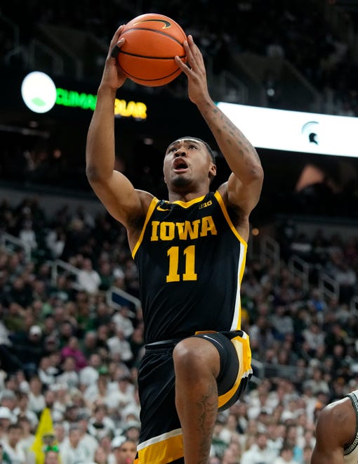 Iowa guard Tony Perkins makes a layup during the first half of an NCAA college basketball game against Michigan State, Thursday, Jan. 26, 2023, in East Lansing, Mich. (AP Photo/Carlos Osorio)