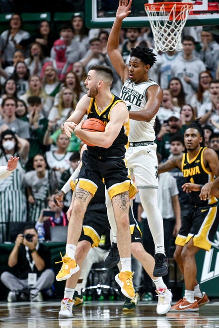 Michigan State's A.J. Hoggard, right, guards Iowa's Connor McCaffery as he makes a rebound and looks to pass for a final shot of the game during the second half on Thursday, Jan. 26, 2023, at the Breslin Center in Lansing.