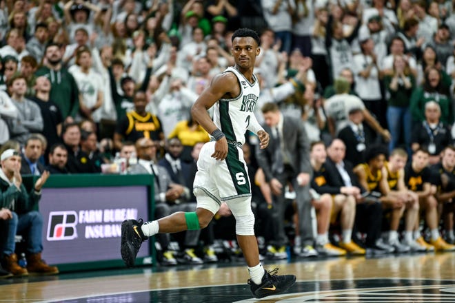 Michigan State's Tyson Walker celebrates his 3-pointer against Iowa during the second half on Thursday, Jan. 26, 2023, at the Breslin Center in Lansing.