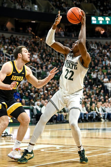 Michigan State's Mady Sissoko, right, looks to shoot as Iowa's Filip Rebraca defends during the first half on Thursday, Jan. 26, 2023, at the Breslin Center in Lansing.