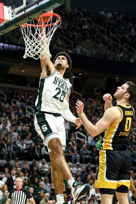Michigan State's Malik Hall dunks agianst Iowa during the first half on Thursday, Jan. 26, 2023, at the Breslin Center in Lansing.