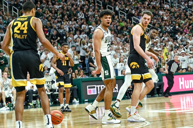 Michigan State's Malik Hall, center, celebrates after a basket against Iowa during the second half on Thursday, Jan. 26, 2023, at the Breslin Center in Lansing.