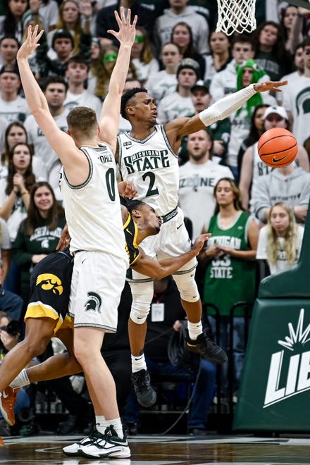 Michigan State's Jaxon Kohler, left, and Tyson Walker pressure Iowa's Ahron Ulis during the first half on Thursday, Jan. 26, 2023, at the Breslin Center in Lansing.