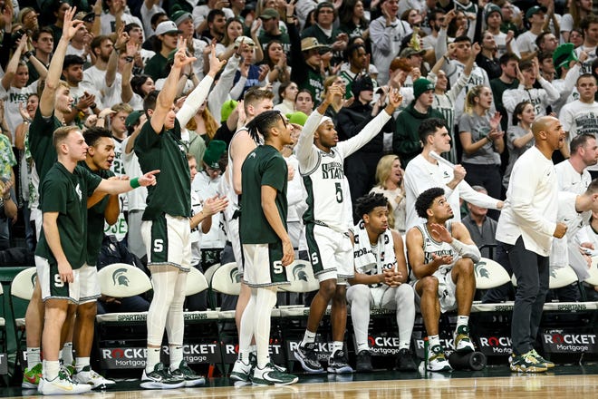 Michigan State's bench celebrates a 3-pointer by Jaden Akins against Iowa during the second half on Thursday, Jan. 26, 2023, at the Breslin Center in Lansing.