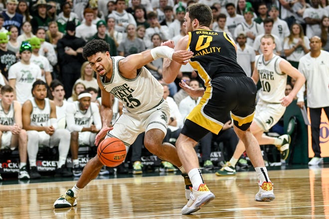 Michigan State's Malik Hall, left, moves past Iowa's Filip Rebraca during the second half on Thursday, Jan. 26, 2023, at the Breslin Center in Lansing.
