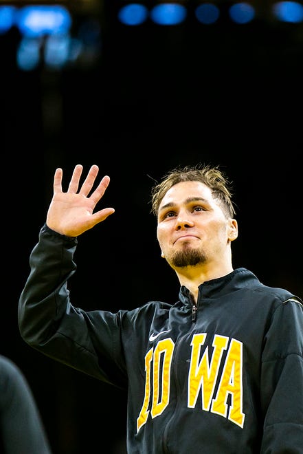 Iowa's Spencer Lee is acknowledged on senior day after a NCAA college men's wrestling dual against Oklahoma State, Sunday, Feb. 19, 2023, at Carver-Hawkeye Arena in Iowa City, Iowa.